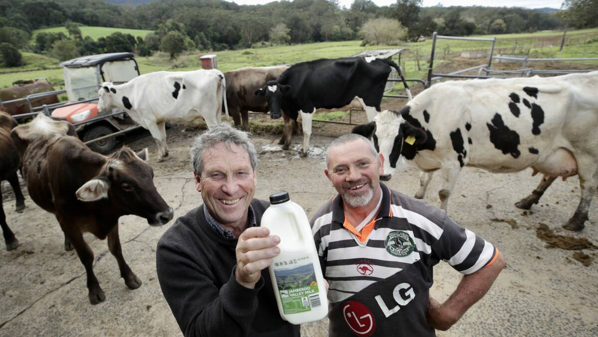 Local drop: Processor John Fairley with farmer Ken Osborne and a bottle of Jamberoo milk. Picture: Adam McLean 