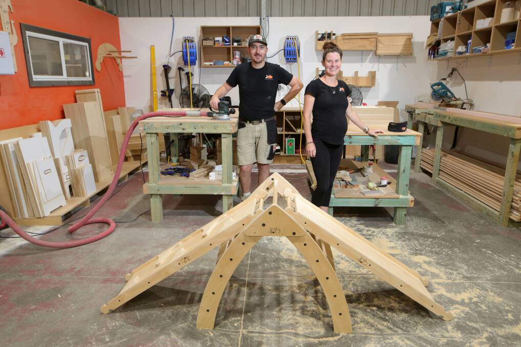 Buy local: Wayne Battishall and Jess Locke with some of the sustainable, locally made play equipment. Picture: Sylvia Liber 