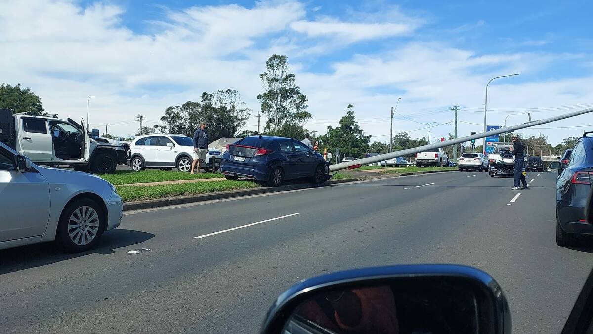 A car collided with a lightpole in Nowra this morning, causing delays.