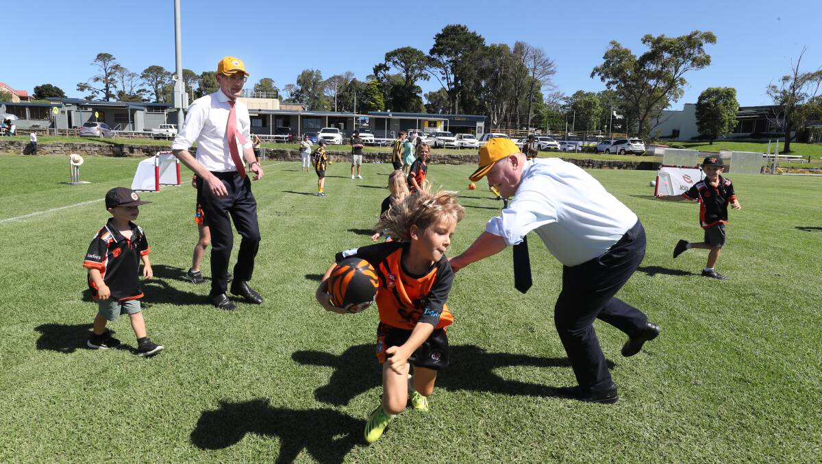Dominic Perrottet joined Heathcote MP Lee Evans in a game of touch footy and to promise funding for Helensburgh's sports fields. Picture by Robert Peet