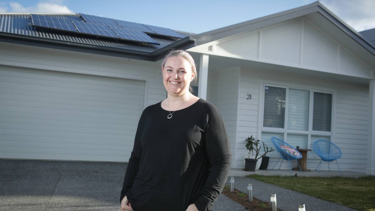 Sigh of relief: Glenda Hunter with her solar power array. Picture: Adam McLean