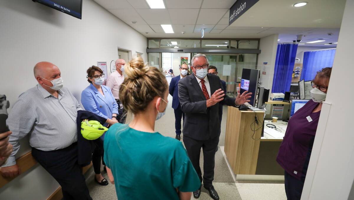 NSW Health Minister Brad Hazzard speaks with medical staff at the Bulli Hospital during a tour of the facility with Heathcote MP Lee Evans (left). Picture by Adam McLean