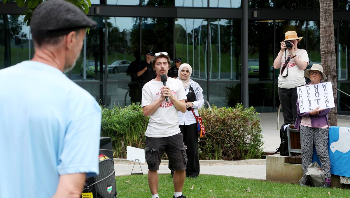 Protest organiser Luke Hocking addresses rally attendees outside Shellharbour Civic Centre. Picture by Sylvia Liber