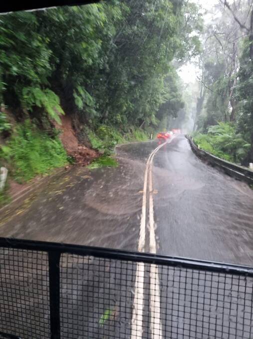 Spill over: Water over the road on Moss Vale Road going up Cambewarra Mountain. Picture: Supplied