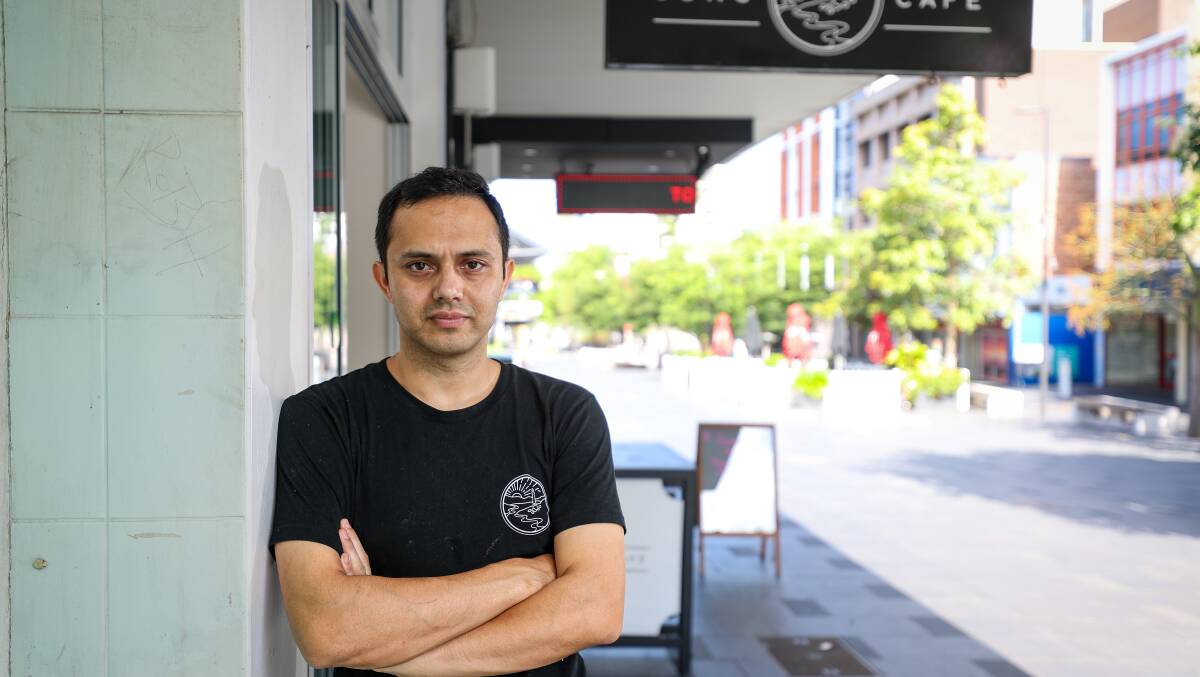Gong Cafe owner Manoj Budhathoki suggested delivery riders should be given permission to access cafes and restaurants in the mall, currently off limits to cyclists and cars. Picture by Adam McLean