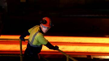 A BlueScope worker inside the hot strip mill. Picture by Sylvia Liber