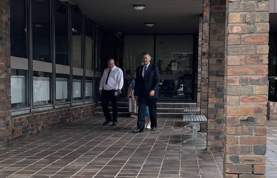 Angela White leaves Port Kembla court house behind her lawyer Michael Sinadinovic.