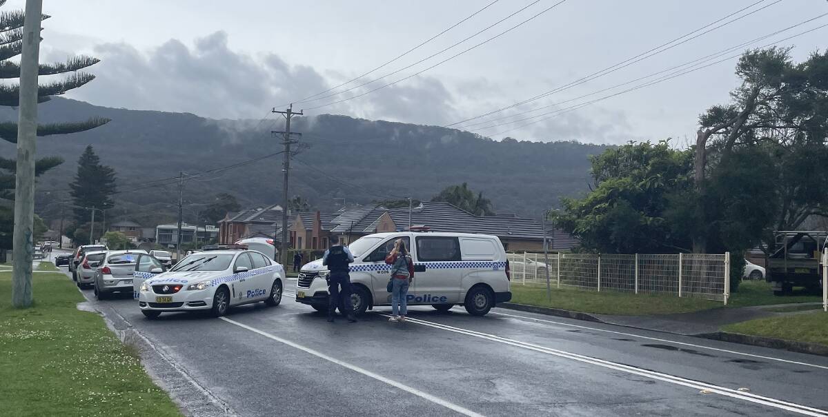 Police blocked off Point Street, Bulli as the incident exploded. Picture by Robert Peet
