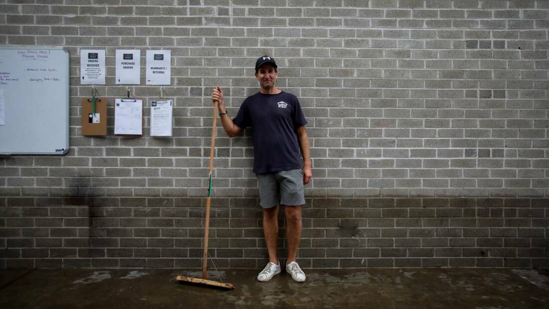 Jamie Adams during the clean up after his business was flooded in March 2022. Picture by Wesley Lonergan