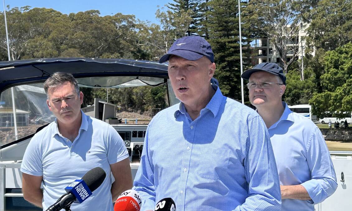 Opposition leader Peter Dutton (centre) with shadow Climate Change and Energy Minister Ted O'Brien (right) and Port Stephens business owner Brent Hancock. Picture by ACM