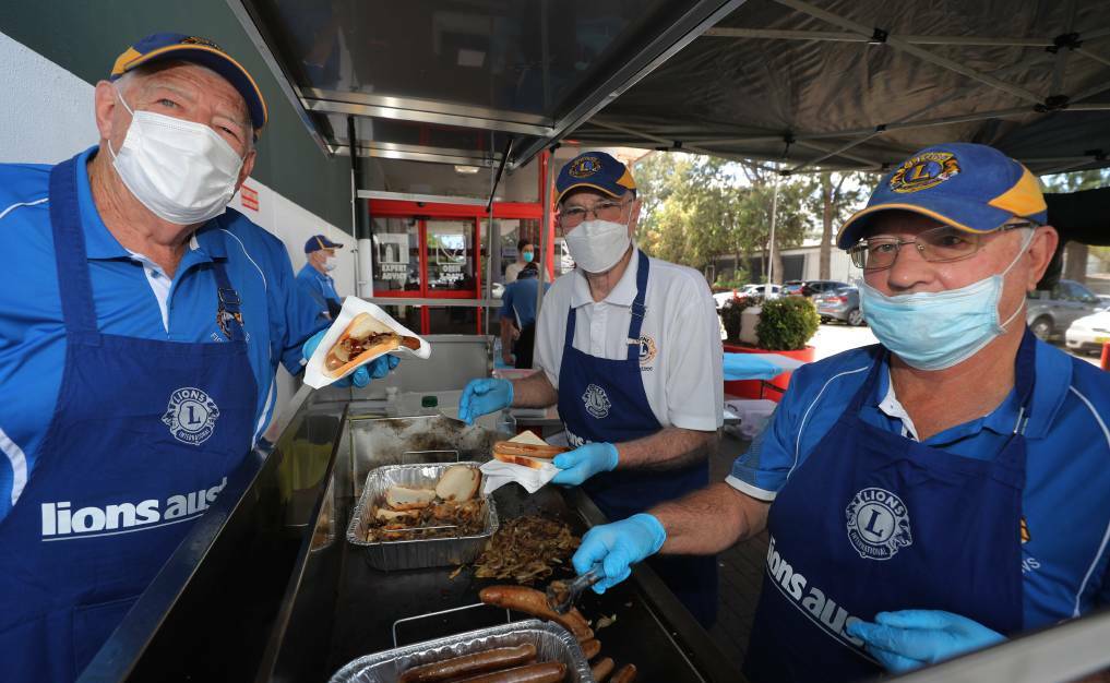 Figtree Lions Club members Kevin Hartley, Rob Sassall and Dave Berry manning the Wollongong Bunnings sausage sizzle in 2021. Picture: Robert Peet.