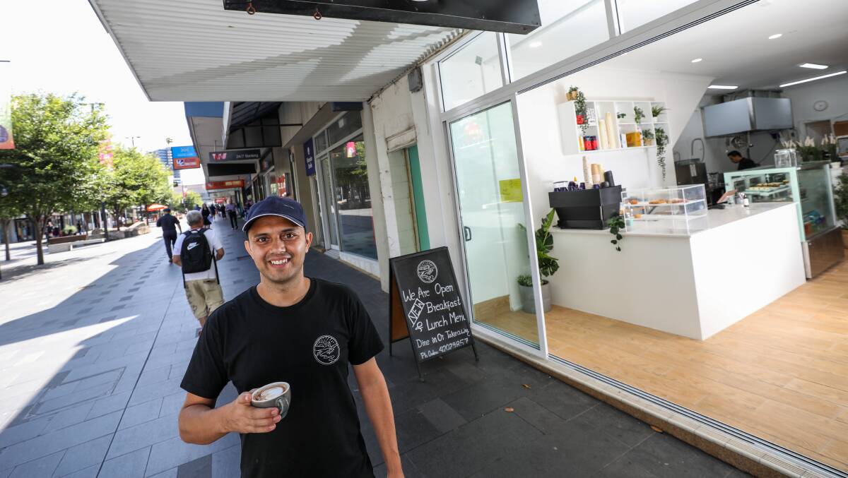 Manoj Budhathoki outside his recently re-opened cafe on Crown Street Mall. Picture by Adam McLean