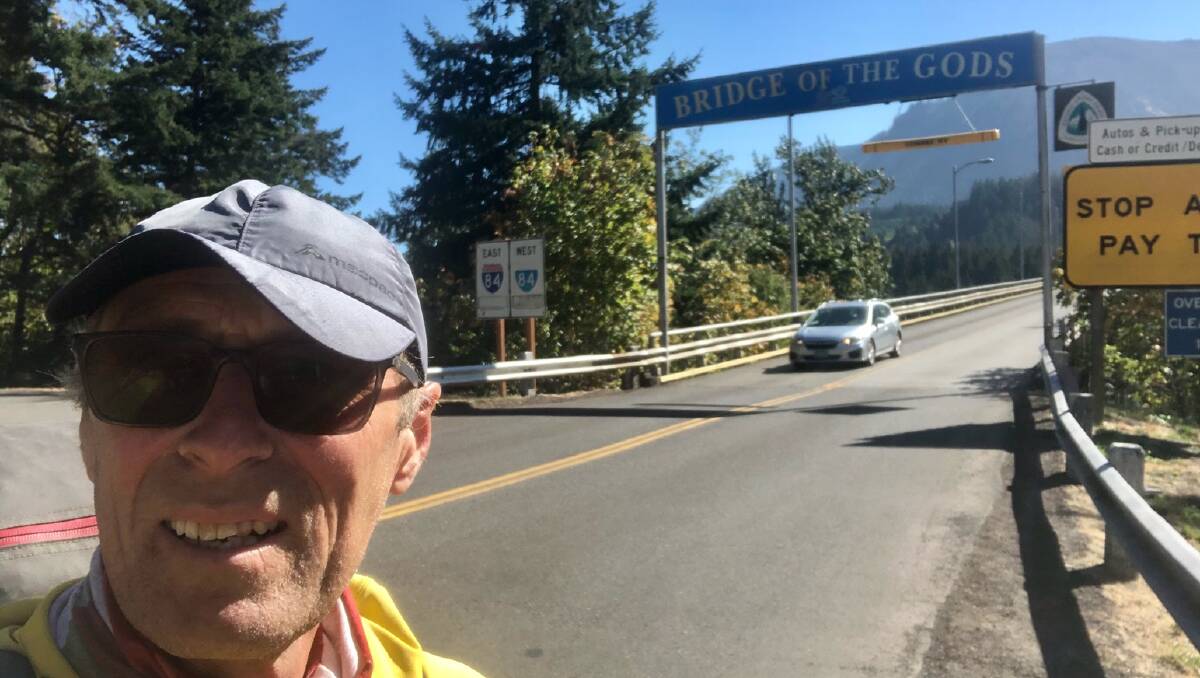 Mike Druce crossing the Bridge of the Gods in Oregon. He is raising money for refugees along the way.