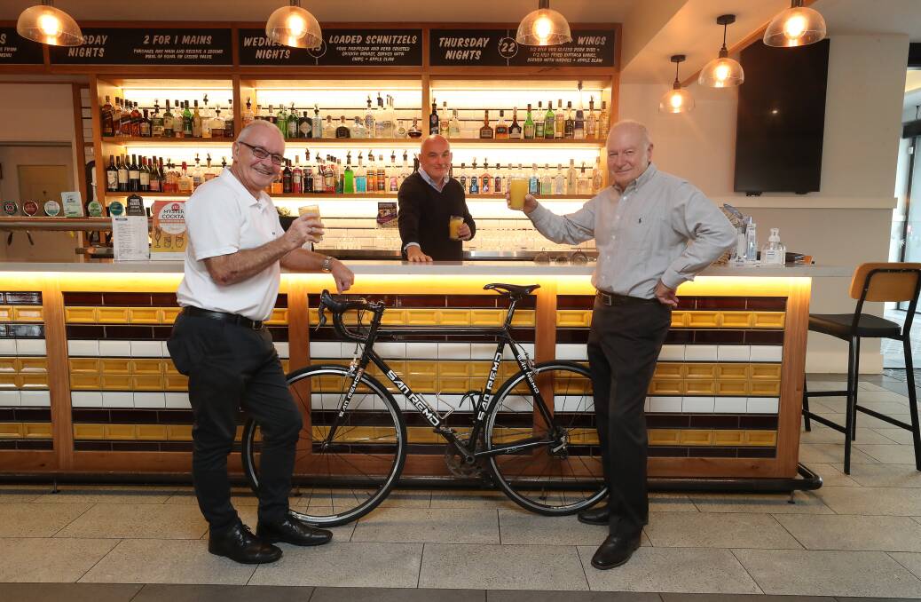 Ride on: (L-R) Stuart Barnes from Destination Wollongong, Paddy Coughlan from the Five Island Hotel and Wollongong Lord Mayor Gordon Bradbery at the launch of the Bike Friendly Business program. Picture: Robert Peet