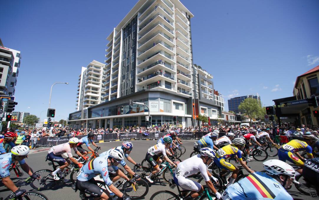Cyclists pass through the CBD during the Men's Elite Road Race on Sunday. Picture by Adam McLean
