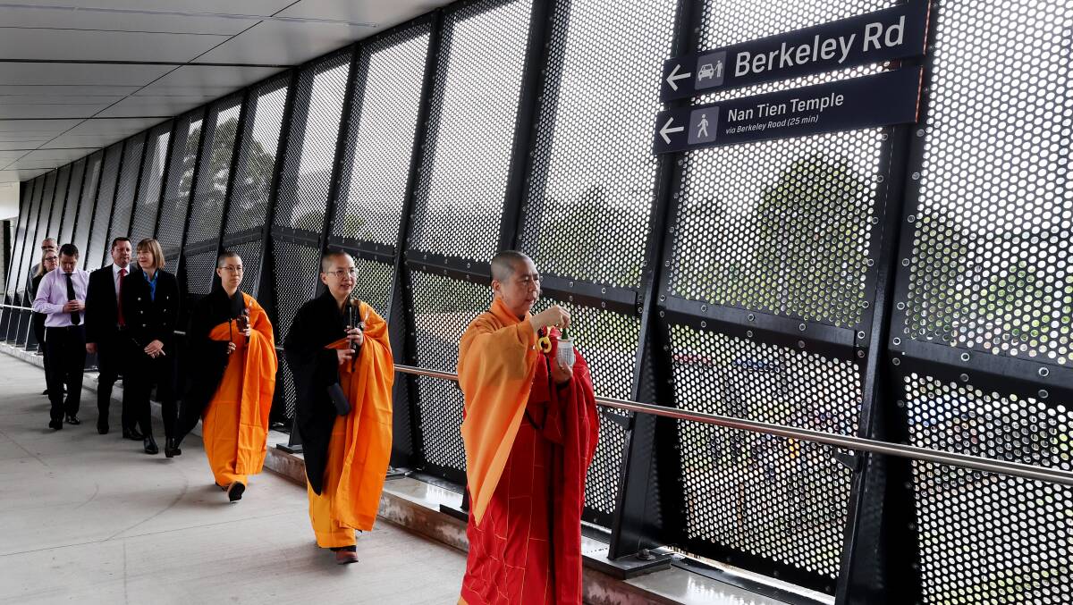 Unanderra station was opened with a blessing by Buddhist monks from the Nan Tien Temple. Picture by Sylvia Liber