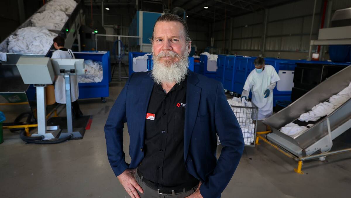 Flagstaff Group CEO Rodney Von Clark in the organisation's commercial laundry in Unanderra. Picture by Wesley Lonergan