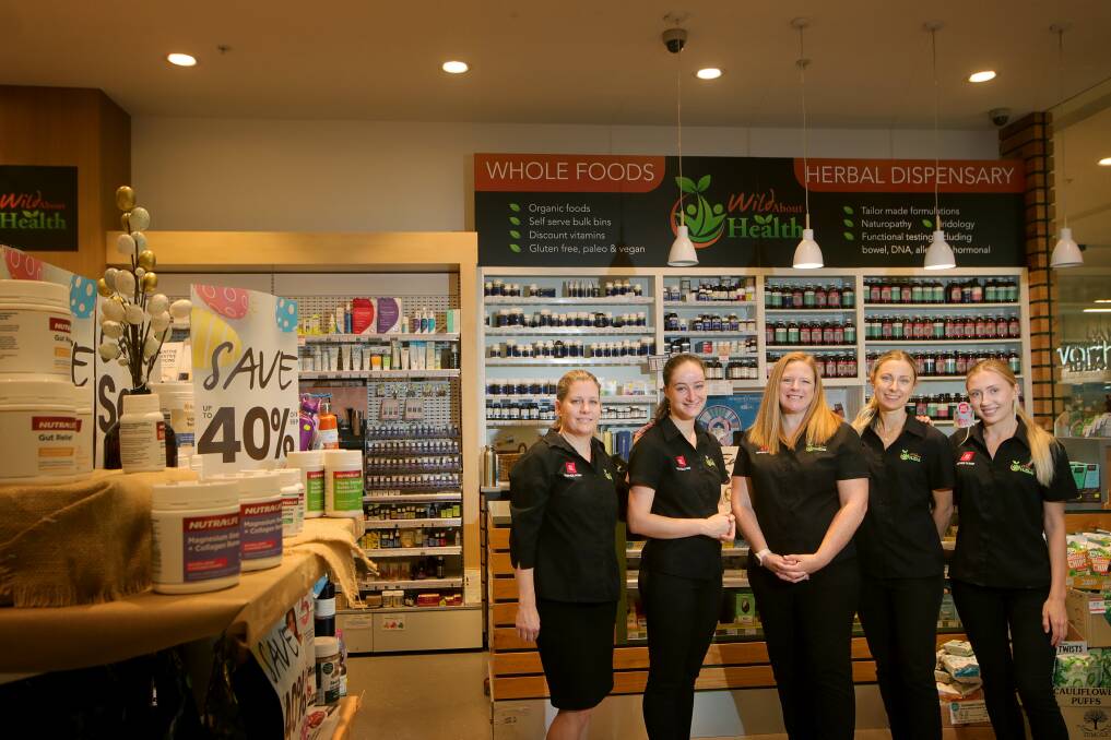 Health trends: Jodie Smith (centre) with staff at the Go Vita Shellharbour store. Picture: Sylvia Liber