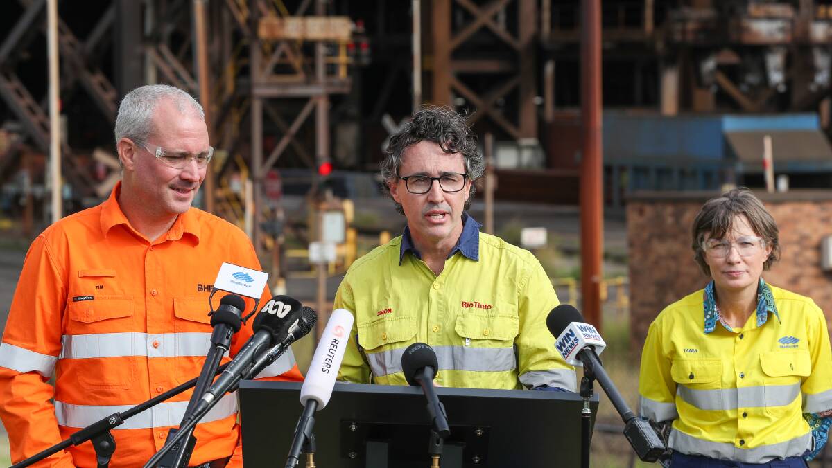Tim Day, Simon Trott and Tania Archibald speak to the media at the green iron partnership announcement. Picture by Adam McLean