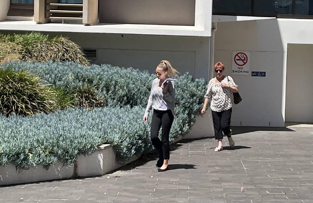 Sarah Witt (left) leaves Wollongong Courthouse after being sentenced for forging prescriptions for pain medication. 