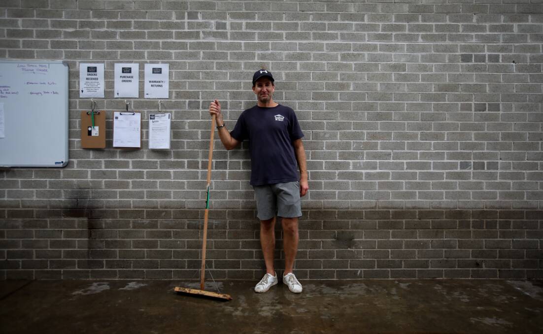 Wash away: Flood waters have left a clear mark on Jamie Adams's business. Picture: Wesley Lonergan