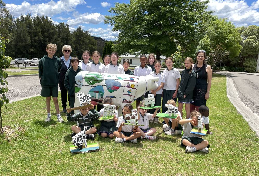 Year 6 and kindergarten students from Frensham Junior School got creative in the Picasso Cows competition and painted Gibsy the Cow. Year 6 yeacher Lynn Venish and art teacher Jacqui Bolt (pictured) helped them with the project. Picture by Briannah Devlin