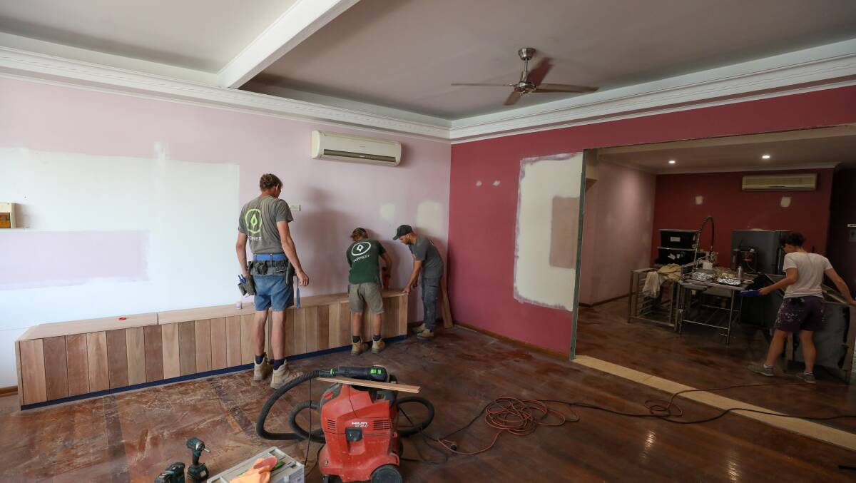 Tradesmen from Forrest Small Homes rennovating the old Thai restaurant, which will be converted into a permanent space for The Eve Project. Photo: Adam McLean
