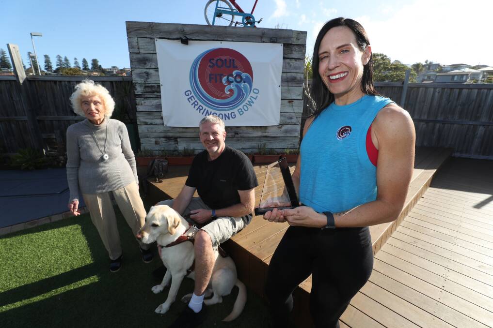 Bev Sherwood, 102, Steve Fox with his guide dog York, and Korin Koutsomihalis at Soul Fit Co studio in Gerringong. Picture by Robert Peet.