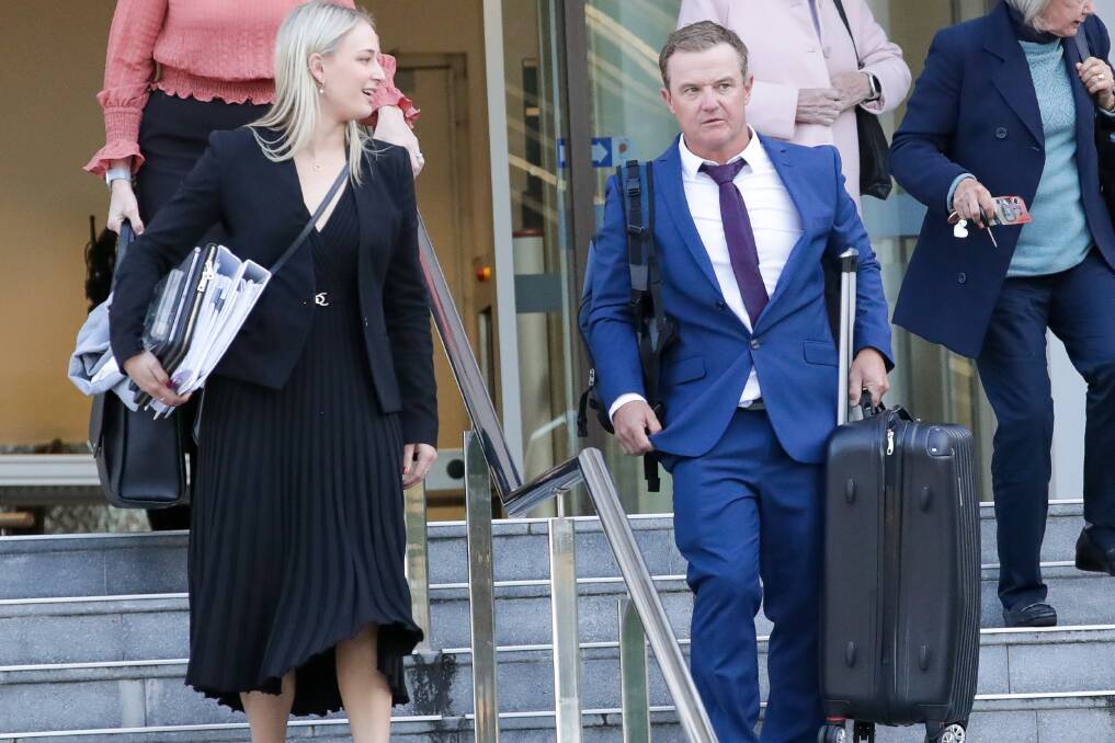 Phil Saunders leaving Wollongong courthouse with his lawyer on Monday. Picture by ACM.