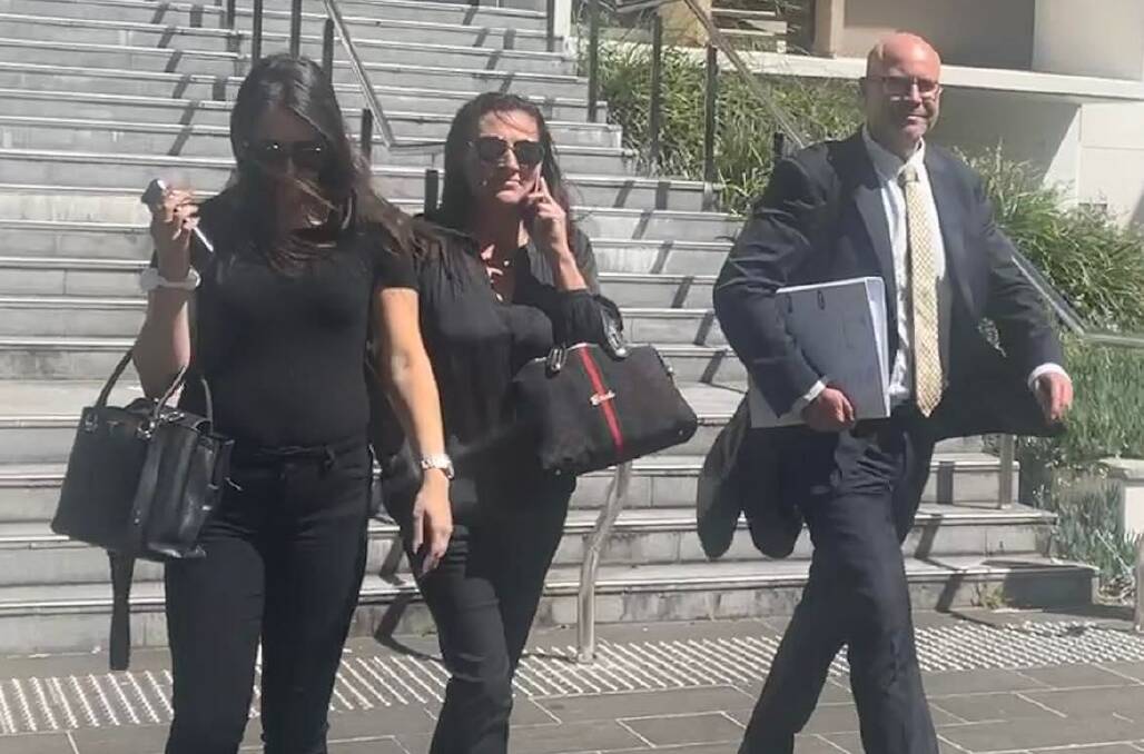 Janette Marsh (middle) leaving court with her daughter and lawyer.