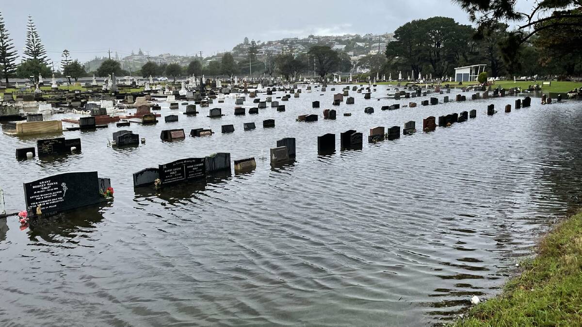 Inundated: Kiama Cemetery was flooded on Tuesday afternoon after heavy rainfall lashed the region. Picture: @KiamaDaisyCow.