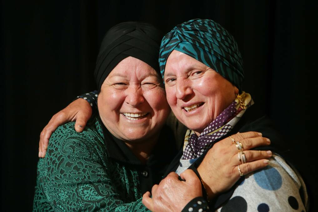 Illawarra cancer survivors Meryem Alevli and Melahat Kayma lean on each other for support at Dapto Ribbonwood Centre on Friday. Picture by Sylvia Liber.
