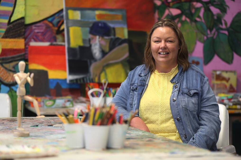 Renee Harding sitting in the art space at Flourish Australia in Wollongong, where she works as a team coordinator peer specialist. Picture by Robert Peet.