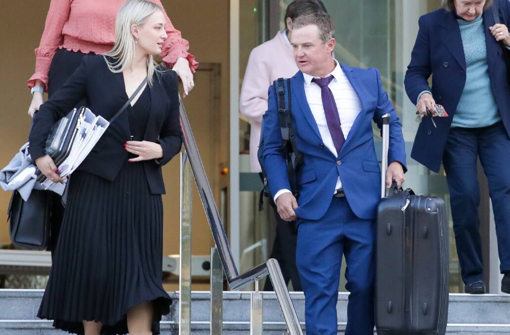 Phil Saunders leaving Wollongong courthouse with lawyer Sophie Newman. Picture by ACM.
