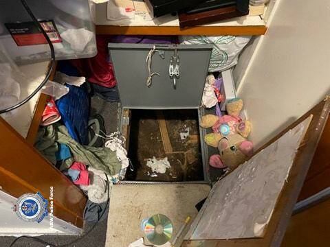 Police found the secret trap door in the Barrack Heights home, which they allege Joel Bill used to hide under the property. Picture from NSWPF.
