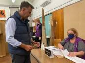 Gilmore Liberal candidate Andrew Constance casting his vote at Sanctuary Point Public School on Saturday. 