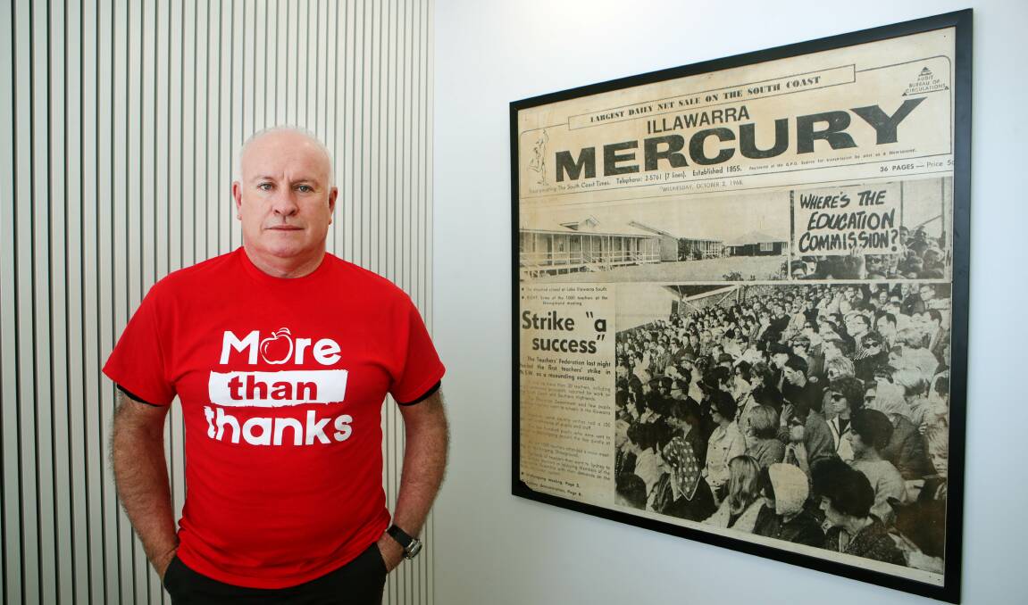 More than thanks: NSW Teachers Federation Illawarra/Shoalhaven organiser Duncan McDonald pictured with an Illawarra Mercury article framed at the union's office - it documents the first Wollongong teacher strike in 1968. Picture: Sylvia Liber. 