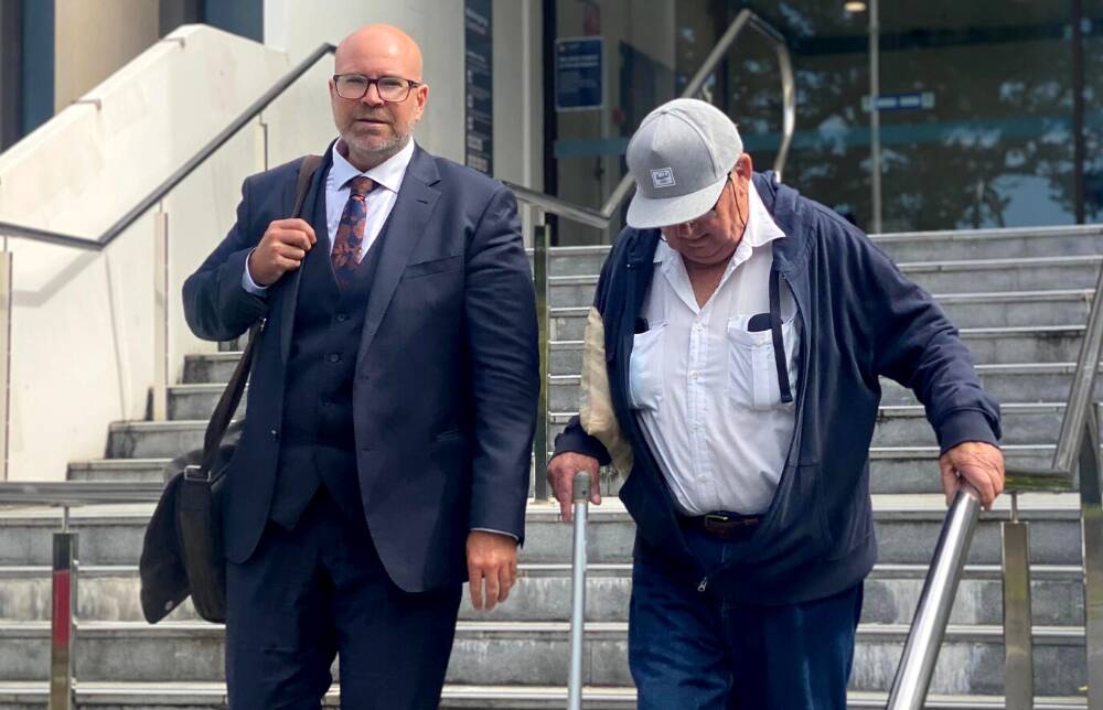 Kenneth MacDonald (right) leaving Wollongong courthouse last week alongside lawyer Patrick Schmidt. Picture by ACM
