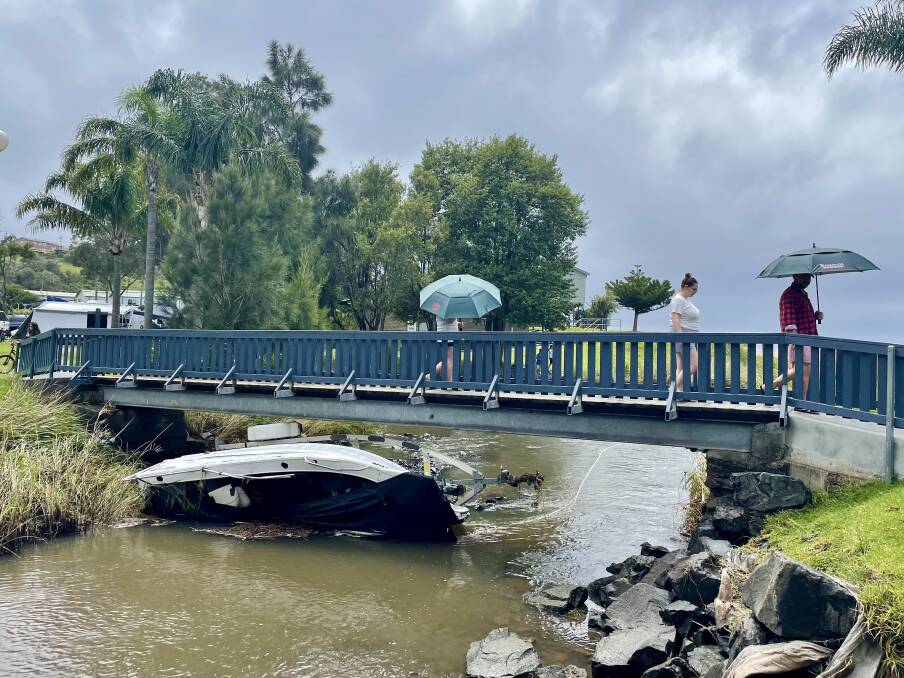 The boat wedged under the foot bridge at the BIG4 Easts Beach Holiday Park on Boxing Day. Picture by Adam McLean