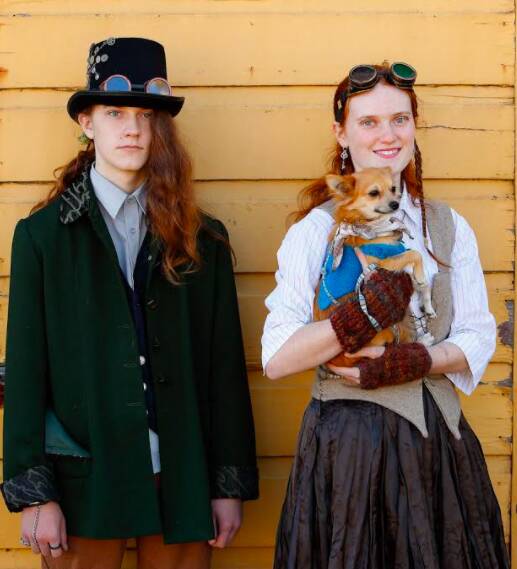 A brother and sister duo dress up with their pet to try out for the fashion competition. 