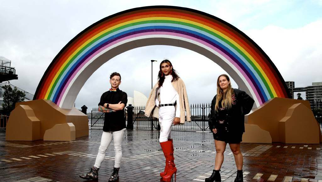 Nicholas Steepe (he/him), Jack Williams (they/them) and Sophie Barber (she/her/they) all live in regional areas and stand in front of Australia's newest landmark which supports the LGBTQIA+ community. Picture: Supplied