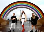Nicholas Steepe (he/him), Jack Williams (they/them) and Sophie Barber (she/her/they) all live in regional areas and stand in front of Australia's newest landmark which supports the LGBTQIA+ community. Picture: Supplied