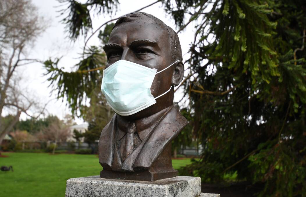 Head bust of former prime minister Robert Gordon Menzies wearing a mask. Photo: Kate Healy 