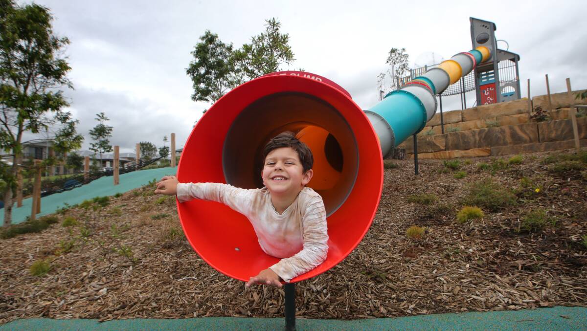 Max Barea, five, couldn't stop smiling after he tried out the new slide at Calderwood