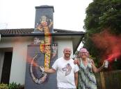 Spraypaint artist Jye 'Jyiro' Westaway and his latest street art chimney creation commissioned by Sharon O'Keefe