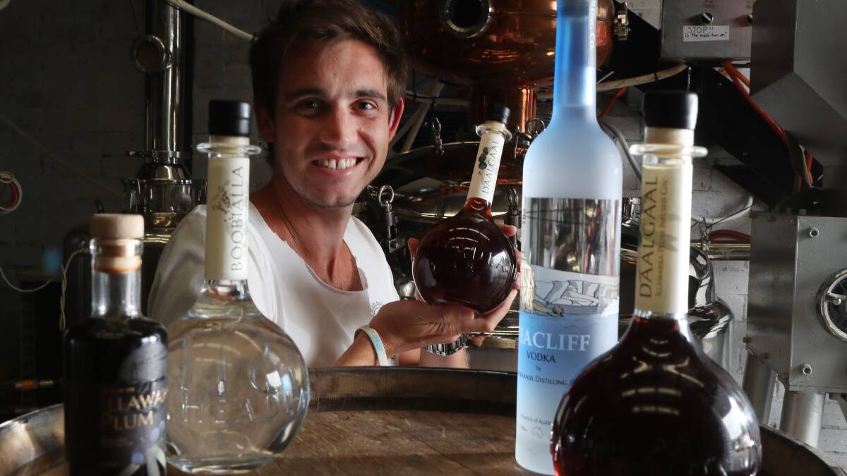 Chin chin: Headlands Distilling Co co-owner Dean Martelozzo with their silver medal winning Daalgaal Illawarra plum infused gin. Picture: Robert Peet