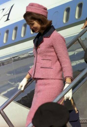 Iconic outfit: Jacqueline Kennedy wearing the pink Chanel suit when she arrived in Dallas the day her husband was assassinated. Picture: Supplied 