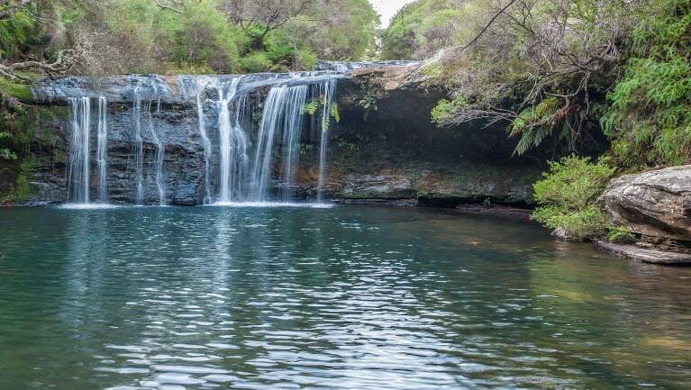 Perfect for children: A waterfall flows into Nellies Glen waterhole in Budderoo National Park. Picture: NSW National Parks & Wildlife Service/Michael Van Ewijk 