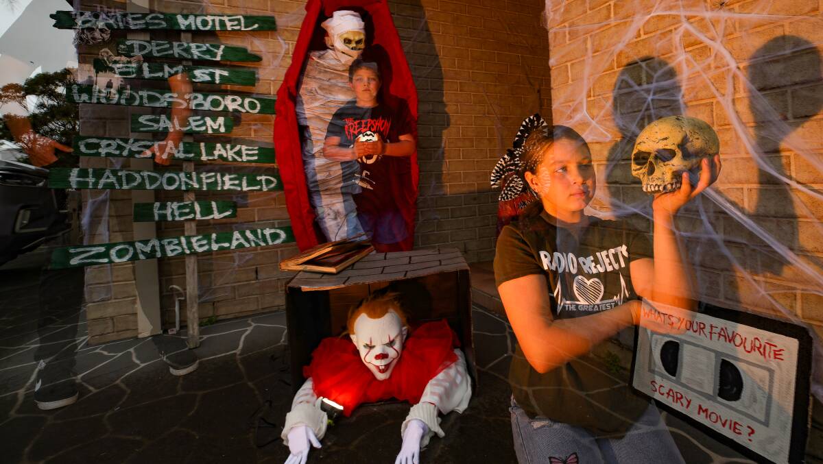 Josh Smith with his children Amari and Cruize will transform their home into Smiths Haunted House and Horror Maze this Halloween. Picture: Adam McLean