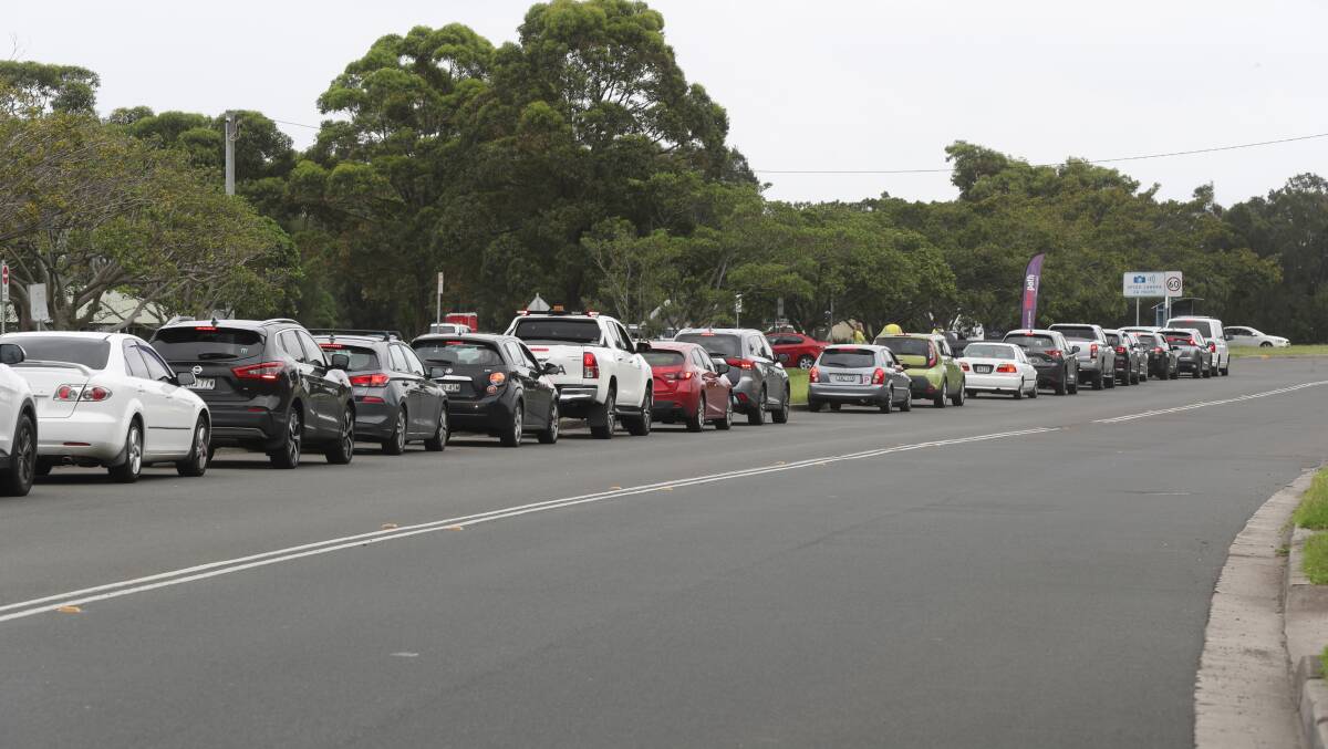Long delays: Cars queue at the Histopath Pathology Drive COVID testing clinic at Northcliffe Drive, Warrawong, today. Picture: Robert Peet